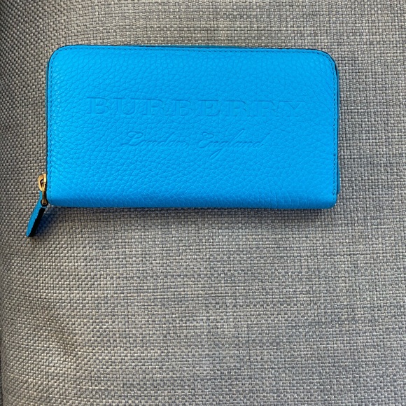 Burberry Handbags - Burberry neon blue zip around wallet